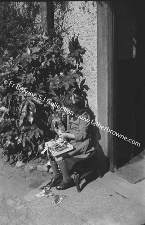 CHILD PLAYING ON DOORSTEP